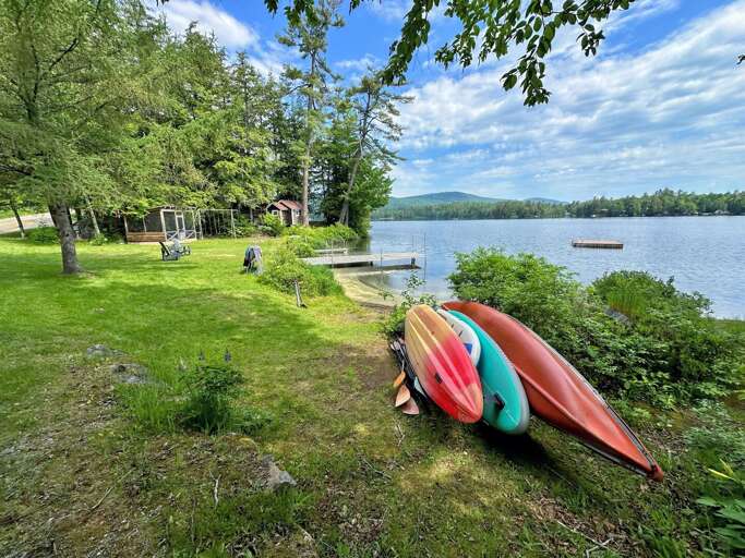 Waterfront area offers seating, a screened porch, dock, swim platform and several different boating options!