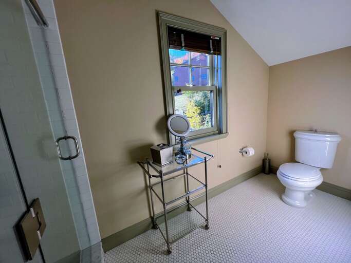 Upper level King bedroom private bath with soaking tub and shower Upper level King bedroom private bath with soaking tub and shower