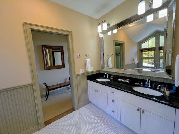 Upper level King bedroom private bath with soaking tub and shower Upper level King bedroom private bath with soaking tub and shower