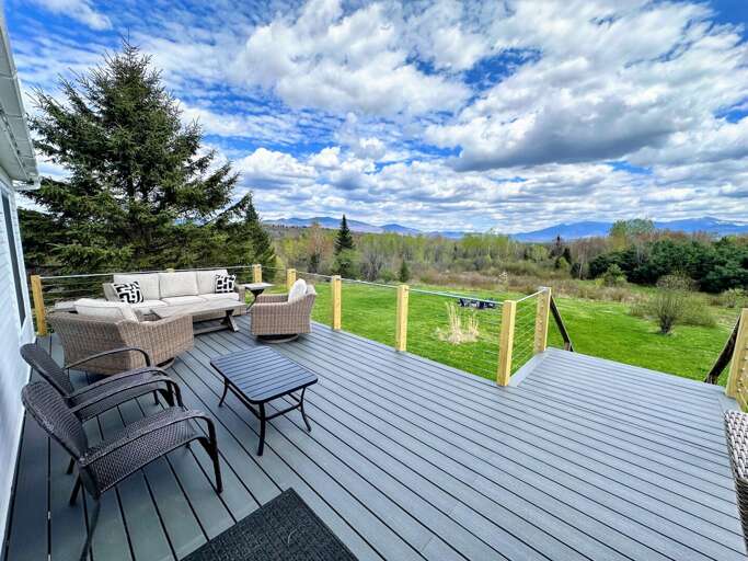 Deck With Outdoor Furniture Overlooking Scenic Landscape