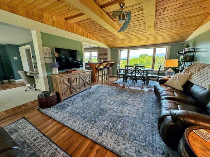 Warm living room with fireplace and TV