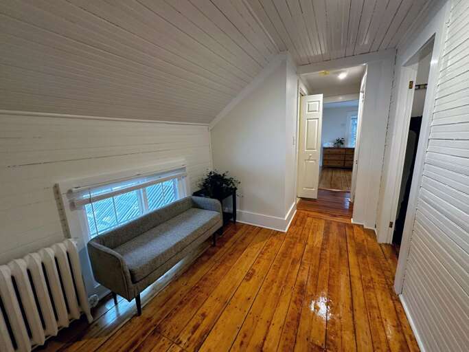 Upper Level Hallway and bi-fold door to half bath Upper Level Hallway and bi-fold door to half bath