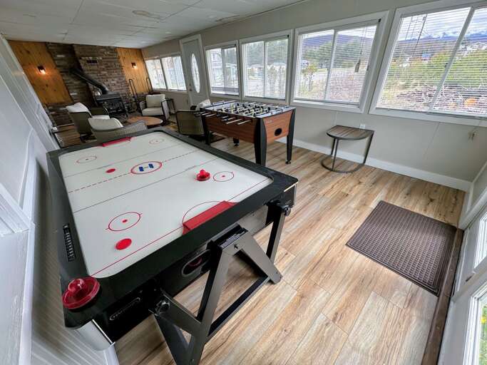 4-season porch with fireplace, foosball and air hockey