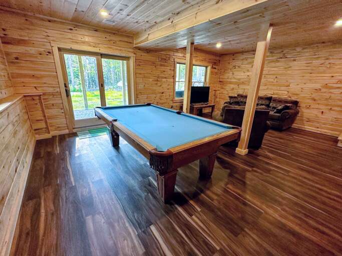 Lower Level Living Area with TV and Pool Table