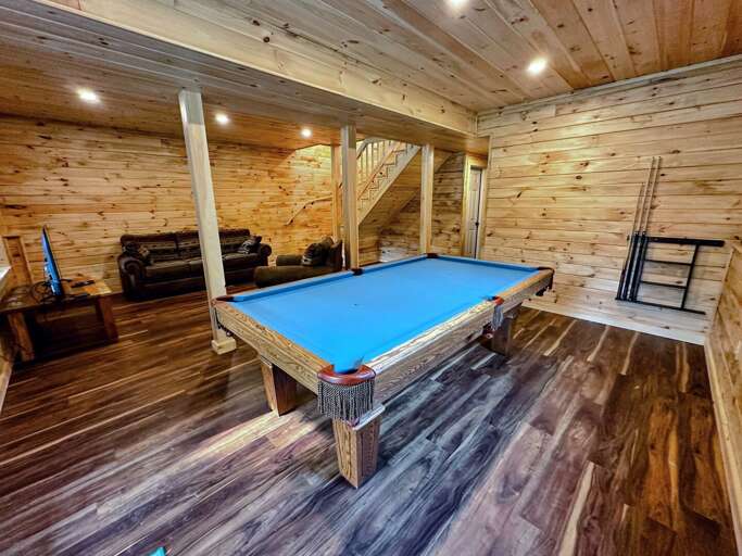 Lower Level Living Area with TV and Pool Table
