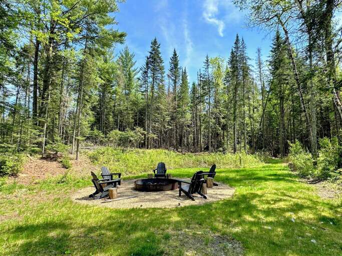 Forest Campfire Area With Chairs
