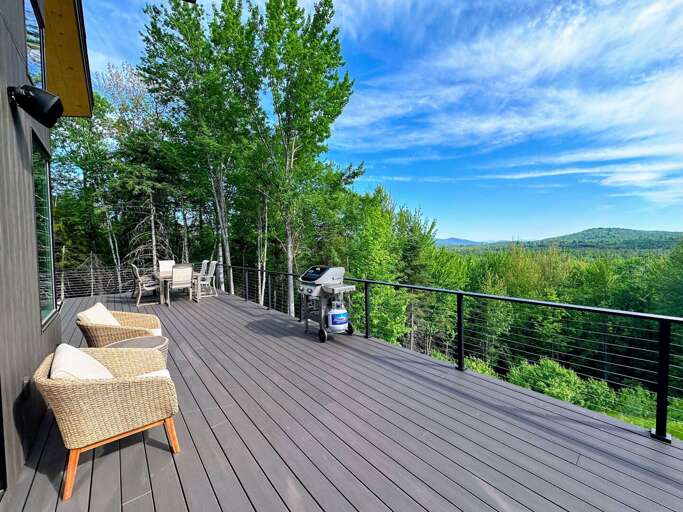 Summer on the patio with dining area and grill