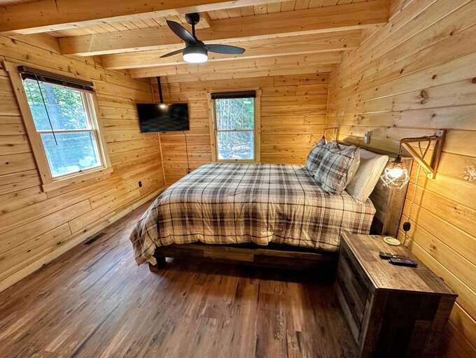 Main Level Queen Bedroom 1 with TV