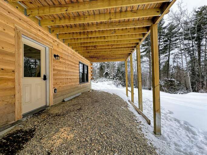 Primary Entrance on Lower Level opens to Lower Level Common Area with Bunk Beds