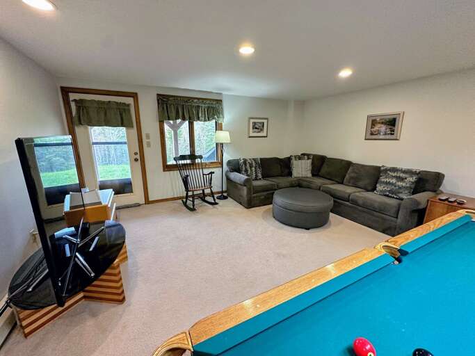 Lower level family room with Pool Table and TV