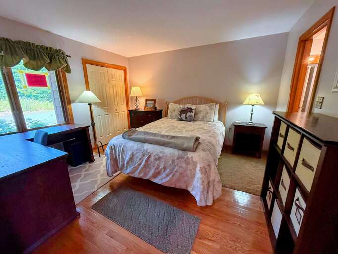 Main Level Queen Bedroom with attached shared Bath with Shower