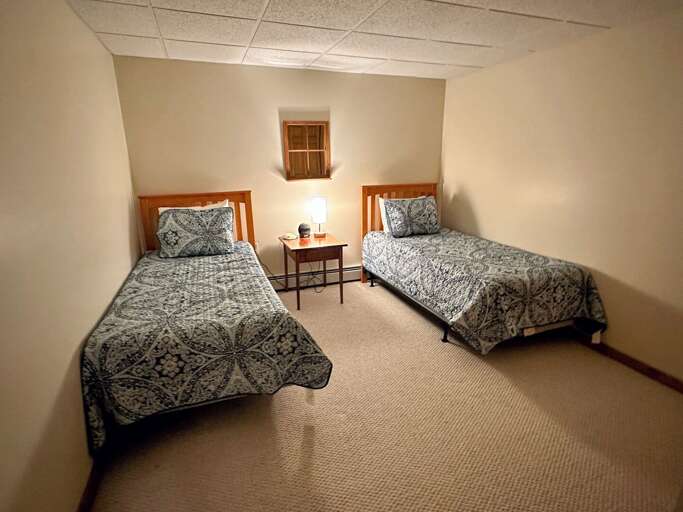 Lower level Twin bedroom - no egress. Outdoor sliding door outside of bedroom. Lower level Twin bedroom - no egress. Outdoor sliding door outside of bedroom.