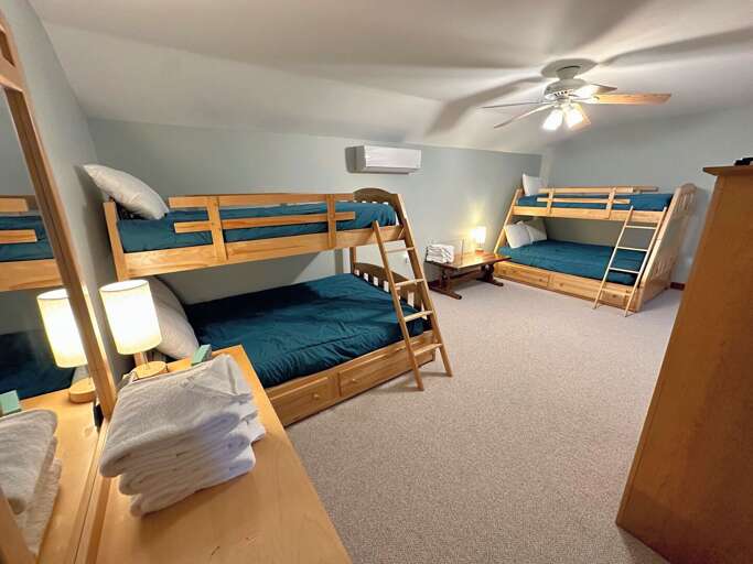 Loft area with two Twin-over-Full bunk beds and AC. A TV is set up with access to a VCR/DVD player. Loft area with two Twin-over-Full bunk beds and AC. A TV is set up with access to a VCR/DVD player.