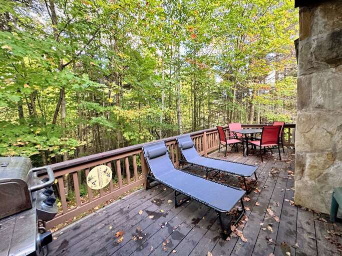 Main level deck has a patio table, loungers and a gas grill Main level deck has a patio table, loungers and a gas grill