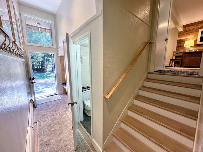 Entry area with bench and half bath