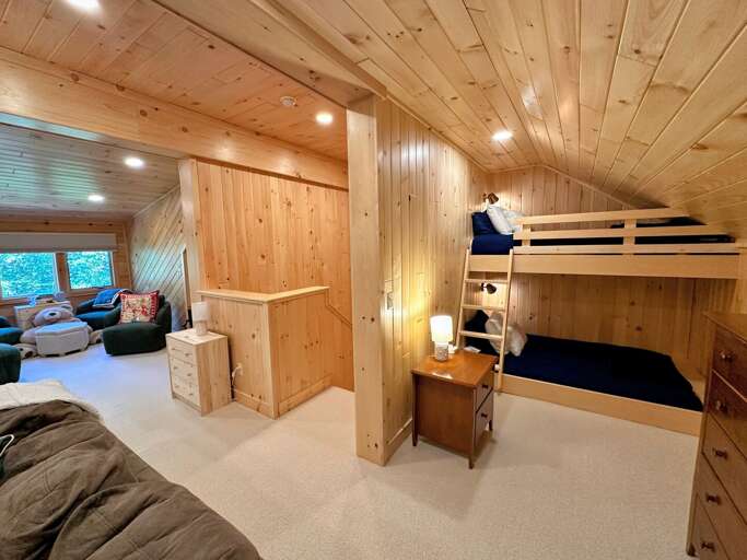 Loft with living area and twin-over-full bunk bed