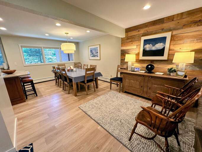 Main Level kitchen and dining area with seating for 10 and a breakfast bar