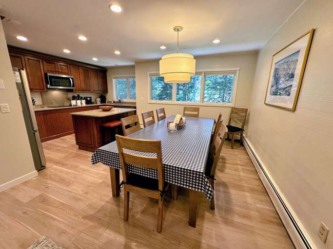 Main Level kitchen and dining area with seating for 10 and a breakfast bar