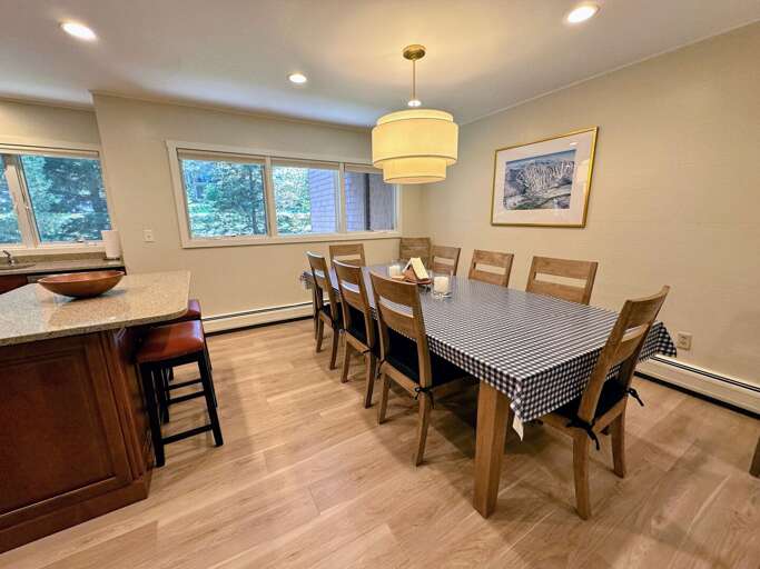 Main Level kitchen and dining area with seating for 10 and a breakfast bar