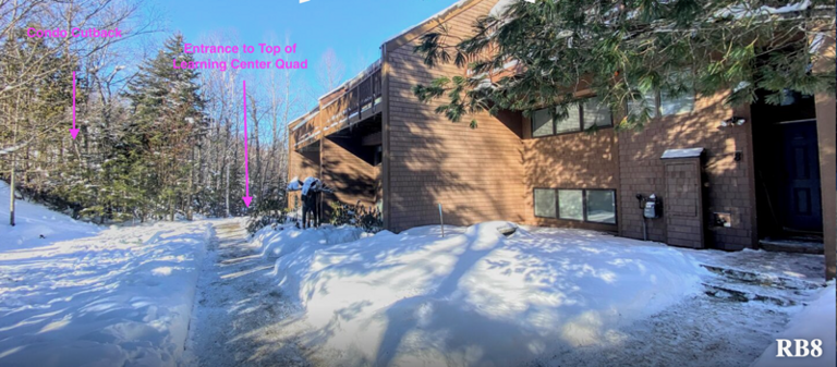 Snowy Scene With A Sunlit Building And Shadowed Path