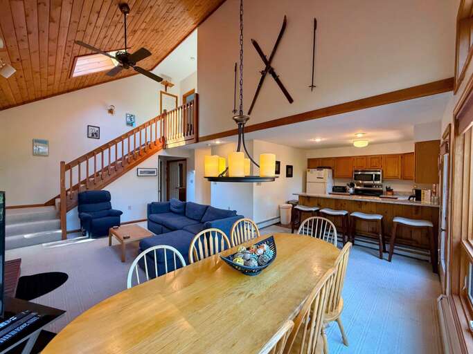 Dining area with seating for 8, views, and breakfast bar with 4 stools.  *Note: dining table rug has been removed since this picture. Dining area with seating for 8, views, and breakfast bar with 4 stools.  *Note: dining table rug has been removed since this picture.
