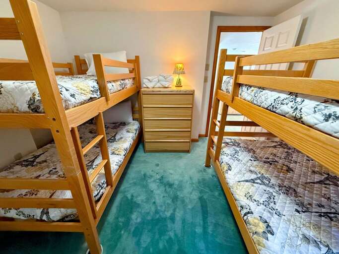 Lower level Bunk Bedroom with two twin-over-twin bunks. Lower level Bunk Bedroom with two twin-over-twin bunks.