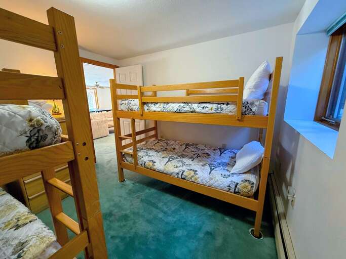 Lower level Bunk Bedroom with two twin-over-twin bunks. Lower level Bunk Bedroom with two twin-over-twin bunks.