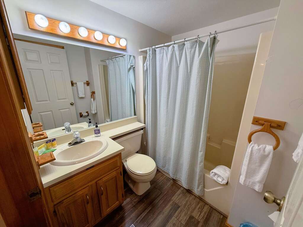 Lower level shared bath with shower/tub combo. Lower level shared bath with shower/tub combo.