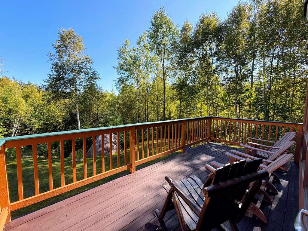 Main level deck with partial views and lots of seating Main level deck with partial views and lots of seating