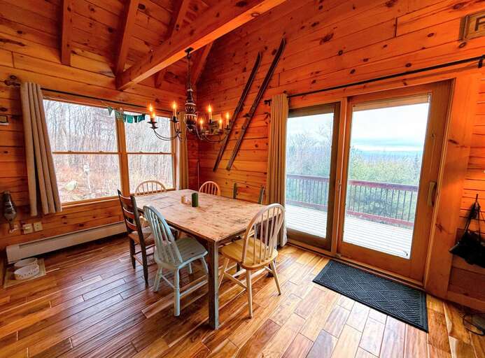 Dining table with plenty of seating and beautiful views. Dining table with plenty of seating and beautiful views.