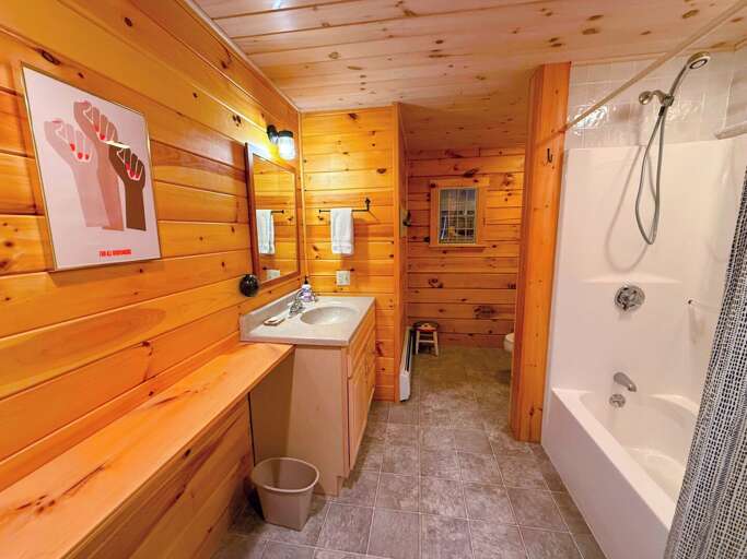 Entry level shared bathroom with a tub/shower combo Entry level shared bathroom with a tub/shower combo