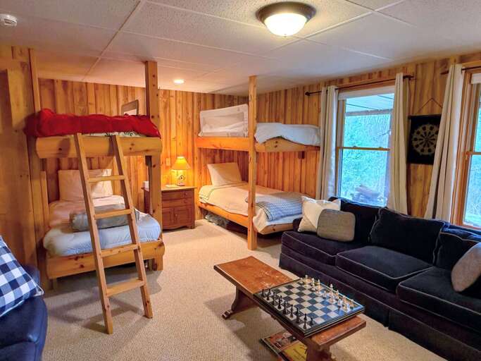 In the lower level doubles as a sleeping space, with two custom-built bunk beds, In the lower level doubles as a sleeping space, with two custom-built bunk beds,