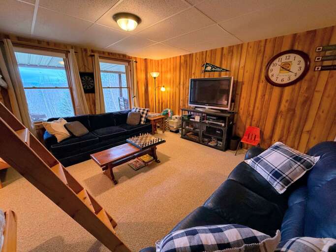 In the lower level you'll find a additional living area with space for the gang to spread out. In the lower level you'll find a additional living area with space for the gang to spread out.