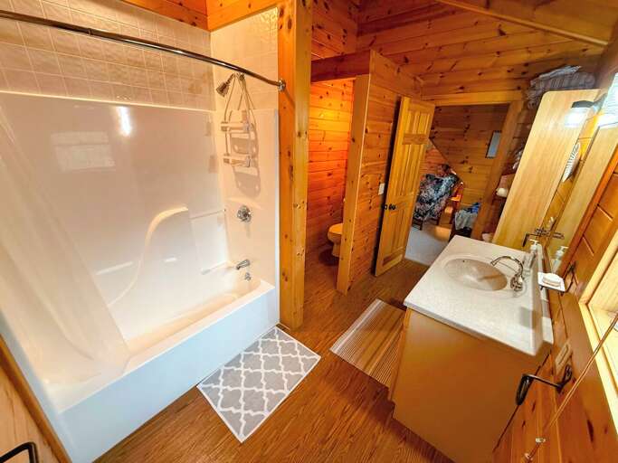 Private bathroom with a tub/shower combo in the King suite Private bathroom with a tub/shower combo in the King suite