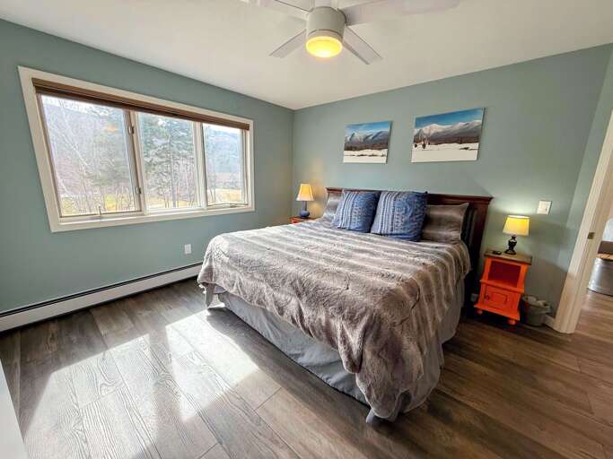 The primary bedroom with a King bed and attached full bathroom The primary bedroom with a King bed and attached full bathroom