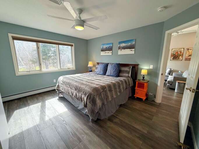 The primary bedroom with a King bed and attached full bathroom The primary bedroom with a King bed and attached full bathroom