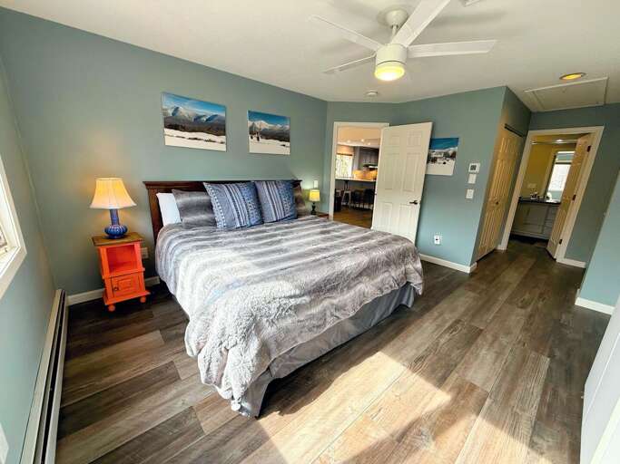 The primary bedroom with a King bed and attached full bathroom The primary bedroom with a King bed and attached full bathroom