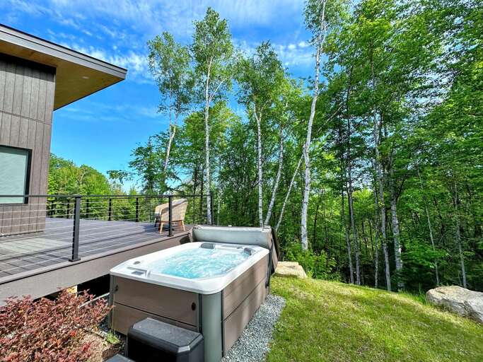 Secluded hot tub with seasonal mountain views