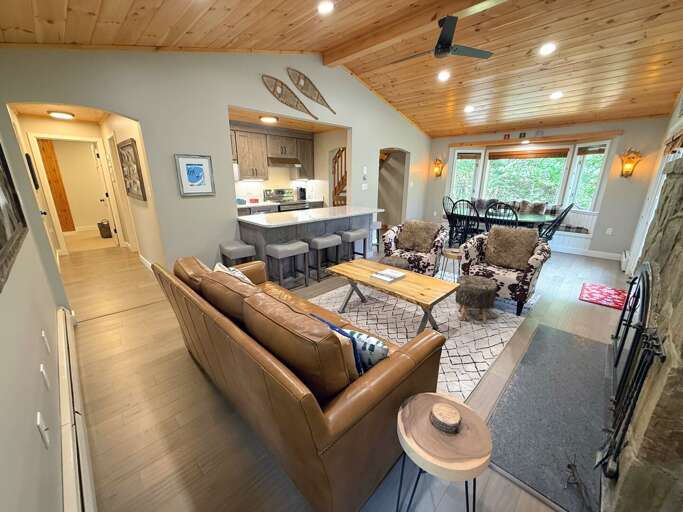 Comfortable seating, a breakfast bar, and the nearby dining area give your group room to relax and catch up.