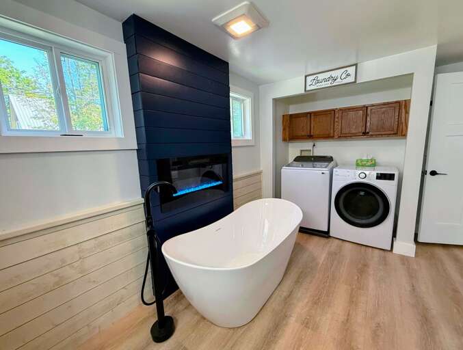 Upper level bathroom also includes laundry.