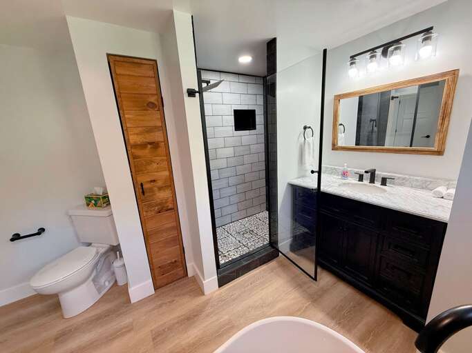 Upper level bathroom with soaking tub and walk-in shower.