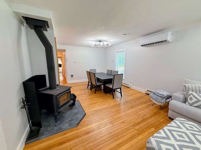 Wood burning fireplace offers warmth and ambiance in the winter months while the AC cools for comfort in the warmer periods.