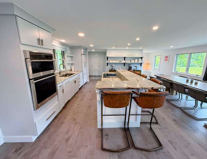 The luxury kitchen features an induction range, dual oven, and everything you need to prepare a gourmet meal.