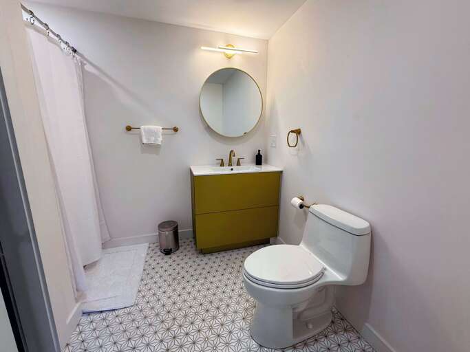 Main level shared bathroom with shower