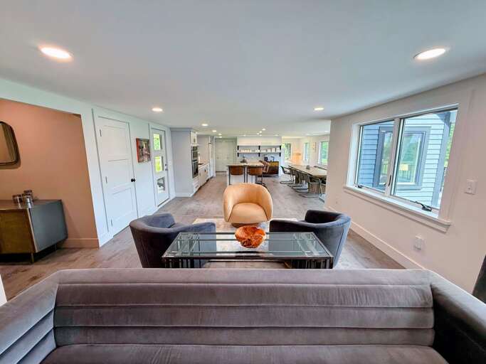 Open concept living, kitchen and dining areas