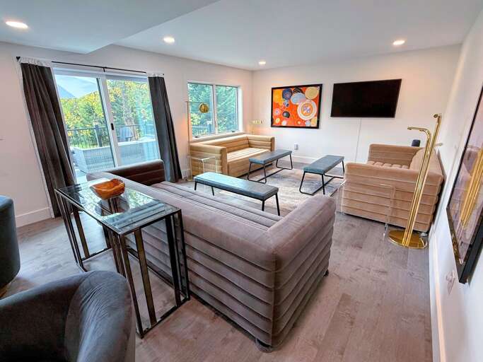 Open-concept living space designed for gathering and relaxation, with many seating areas to take advantage of the serene views or watc TV.