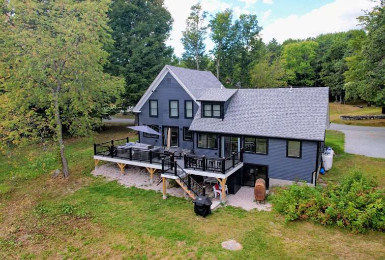 Step onto the expansive deck, where you'll find ample outdoor seating Step onto the expansive deck, where you'll find ample outdoor seating