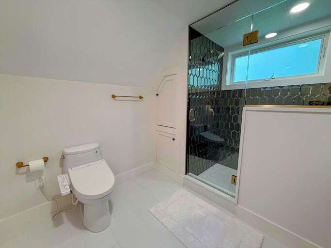 Upper Level King + Twin ensuite full bath with walk-in shower and bidet toilet