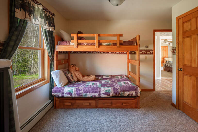 Another guest room, featuring a Double bed and a Twin bed in bunk configuration