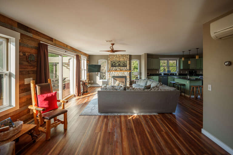 A large living room upstairs, complemented by a second living area on the same level and more living and play space downstairs!